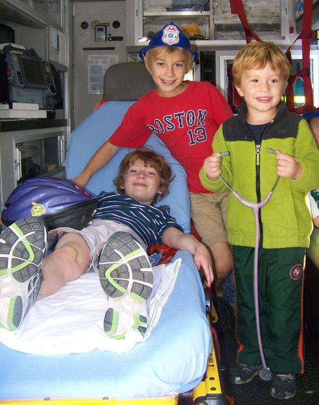 EMTs in training, from left, Henry Richins, Max Richins and Charlie Dube practice their skills inside an ambulance. BY MATTHEW BERNAT